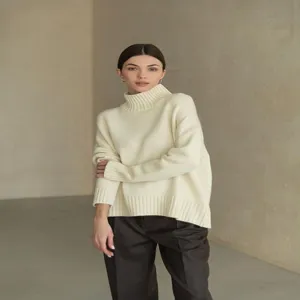 Details of the women's minimalist off-white turtleneck loose knit sweater for autumn and winter.
