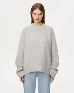 Detailed view of a stylish grey crew neck loose knit sweater for women, comfortable wear.
