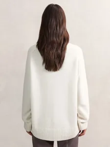 Detailed view of the cozy oversized women knit sweater showing back texture and ribbed hem.