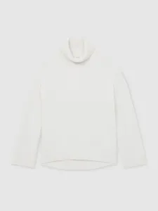 Close-up detail of a cozy white turtleneck knitted sweater featuring ribbed collar and cuffs.