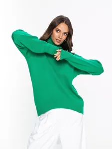 Detailed view of women's green turtleneck sweater, loose autumn winter knitwear style.
