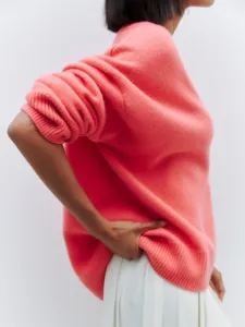 Chic pink knit sweater for women, comfortable loose long sleeve casual pullover top.