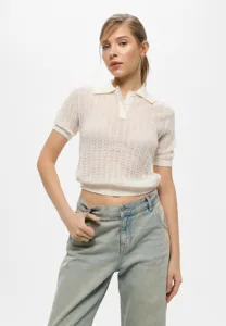 Detail shot of a women's short-sleeve knit polo top featuring a classic collar and buttons.