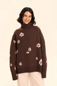 Brown floral jacquard turtleneck sweater detailed view, cozy loose knitwear for autumn winter.