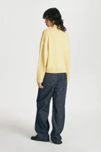Women's loose high-neck knit sweater, short style detail view, comfortable daily winter wear.