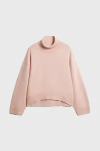 Pink turtleneck knit sweater detail, cozy oversized fit, long sleeves, ribbed hem knitwear.