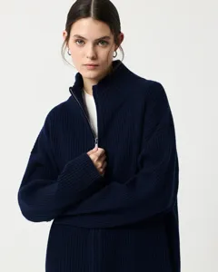 Close-up detail shot of the stylish dark navy blue ribbed knit half-zip cardigan sweater.