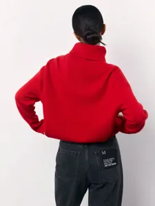 Red turtleneck sweater detail, loose knitwear texture, cozy winter style apparel back view.