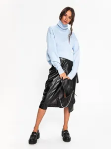 Detailed shot of women casual loose turtleneck sweater paired with chic leather skirt and shoes.
