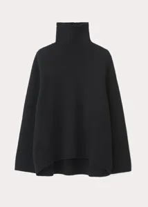 Detailed view of the women black turtleneck sweater, showing soft loose knit texture.