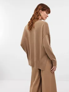 Women's camel oversized high-neck knit sweater with side slits, rear view studio shot