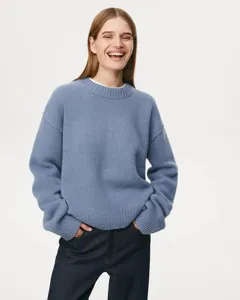 Casual blue crew-neck knitted sweater for women, loose fit autumn and winter fashion style.