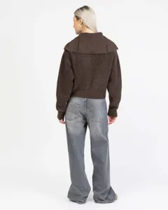 Back view of a brown knitted cardigan featuring a stylish lapel collar and cozy texture.