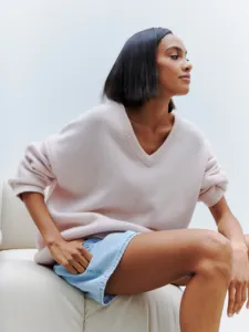 Casual V-neck loose long sleeve knitted sweater for women, comfortable daily wear detail.