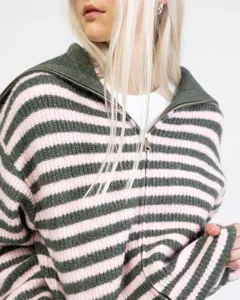 Detailed close-up view showing the half-zip collar and striped knit sweater texture.