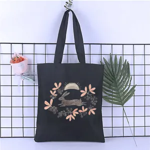 Canvas tote bag with cute rabbit print, casual Harajuku style shoulder handbag for students shopping.