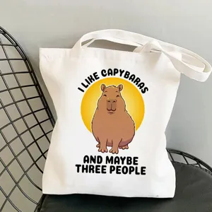 Cute capybara print canvas tote bag, casual shoulder handbag for daily shopping and travel.