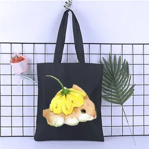 Detailed view of the cute cartoon rabbit print canvas tote bag showing graphic design.