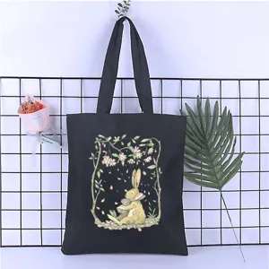 Black canvas casual tote bag with cute cartoon rabbit illustration for everyday use