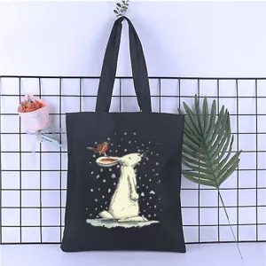 Black canvas tote bag with cute rabbit and bird print, casual shoulder shopping bag for students.