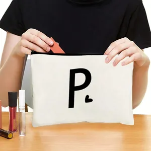 Custom zipper cosmetic bag with stylish letter print, portable makeup storage pouch for travel.