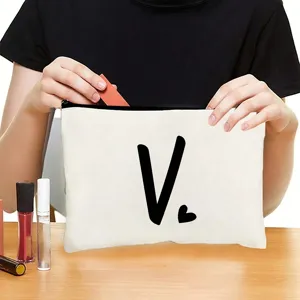 Canvas cosmetic bag with zipper closure, featuring minimalist letter print for daily makeup storage.