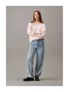 Women's crewneck knit sweater paired with blue denim jeans and loafers, main fashion view.