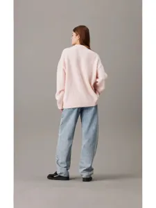 Oversized pink crewneck knit sweater worn by model, back view for women fashion apparel.