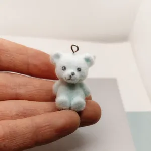 Flocked resin bear charm detail view, cute miniature animal pendant for DIY jewelry making