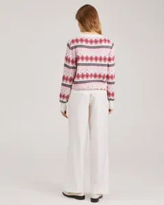 Women's pink crewneck knit sweater with red geometric jacquard pattern for autumn.