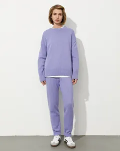 Detailed view of a cozy light purple knit sweater set worn by model against a clean studio backdrop.