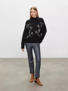 Women mock neck long sleeve black knit sweater with white floral embroidery for autumn winter.