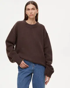 Close-up detail of stylish brown crewneck knit sweater, soft texture for autumn wear.