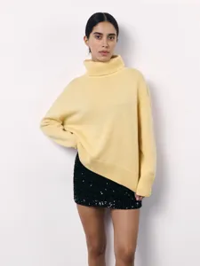 Women turtleneck loose knit sweater detail view, elegant autumn winter warm pullover top.
