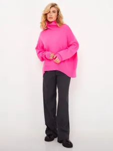 Pink turtleneck sweater detail showing loose fit design and soft knit texture for daily winter wear.