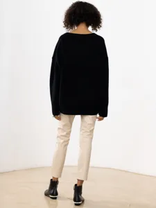 Cozy black V-neck loose long-sleeve sweater, stylish autumn and winter casual apparel.