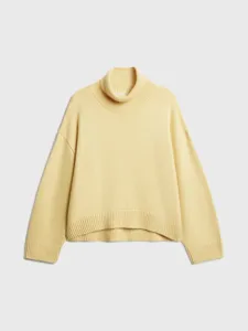 Women's casual loose turtleneck short knit sweater in pale yellow for autumn winter.