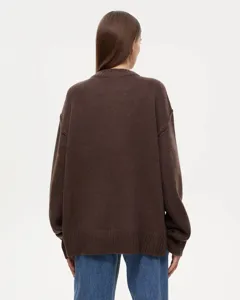 Back view detail of women's brown oversized knit sweater, showcasing loose fit and soft fabric.