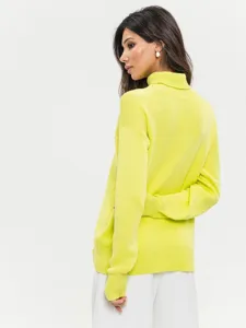Detailed view of the neon yellow turtleneck knit sweater back, soft textured fabric.