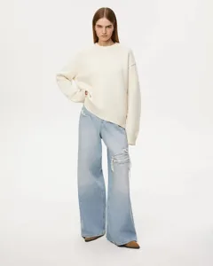 Detailed view of the casual crewneck knit sweater with comfortable loose fit and long sleeves.