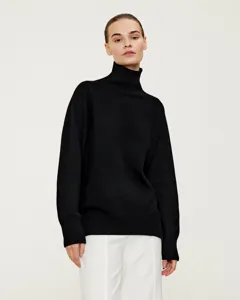 Classic black turtleneck sweater detail view, showcasing soft knit fabric and comfortable loose fit.