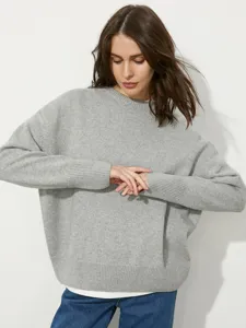 Classic women's grey crew neck knit sweater, loose pullover fit for autumn and winter daily.