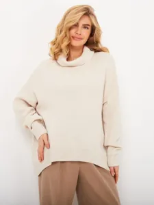 Detailed view of the casual beige loose turtleneck knit sweater, soft texture, cozy winter wear
