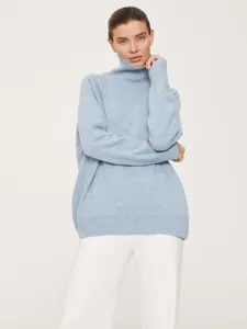 Loose fit turtleneck sweater for women in light blue, ideal for autumn and winter season.