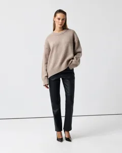 Womens casual beige crewneck knit sweater detail view showcasing soft cozy texture.