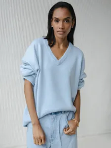 Light blue V-neck knit sweater detail, cozy oversized long sleeve pullover for women daily style.