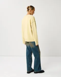 Knit sweater back detail view showing relaxed fit, long sleeves, and ribbed crewneck design.