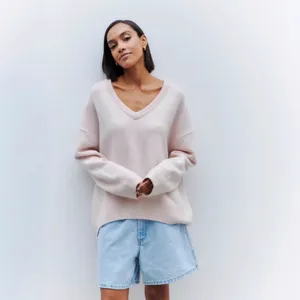 Women V-neck loose long sleeve knit sweater in casual style for autumn and winter season.