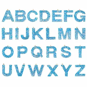 Epoxy resin blue glitter alphabet letter pendant details, DIY keychain accessories display.