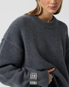 Women casual loose-fit crew neck long sleeve knit sweater in dark grey, ideal for winter season.